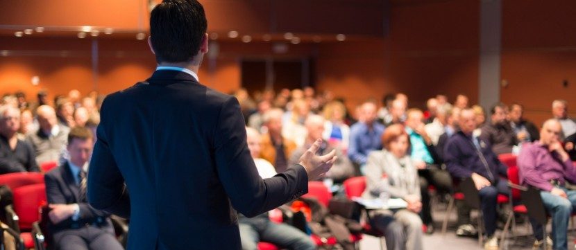 bigstock-Speaker-at-Business-Conference-65279563_1000_440_s_c1_c_c-830x365-e1507903863212.jpg